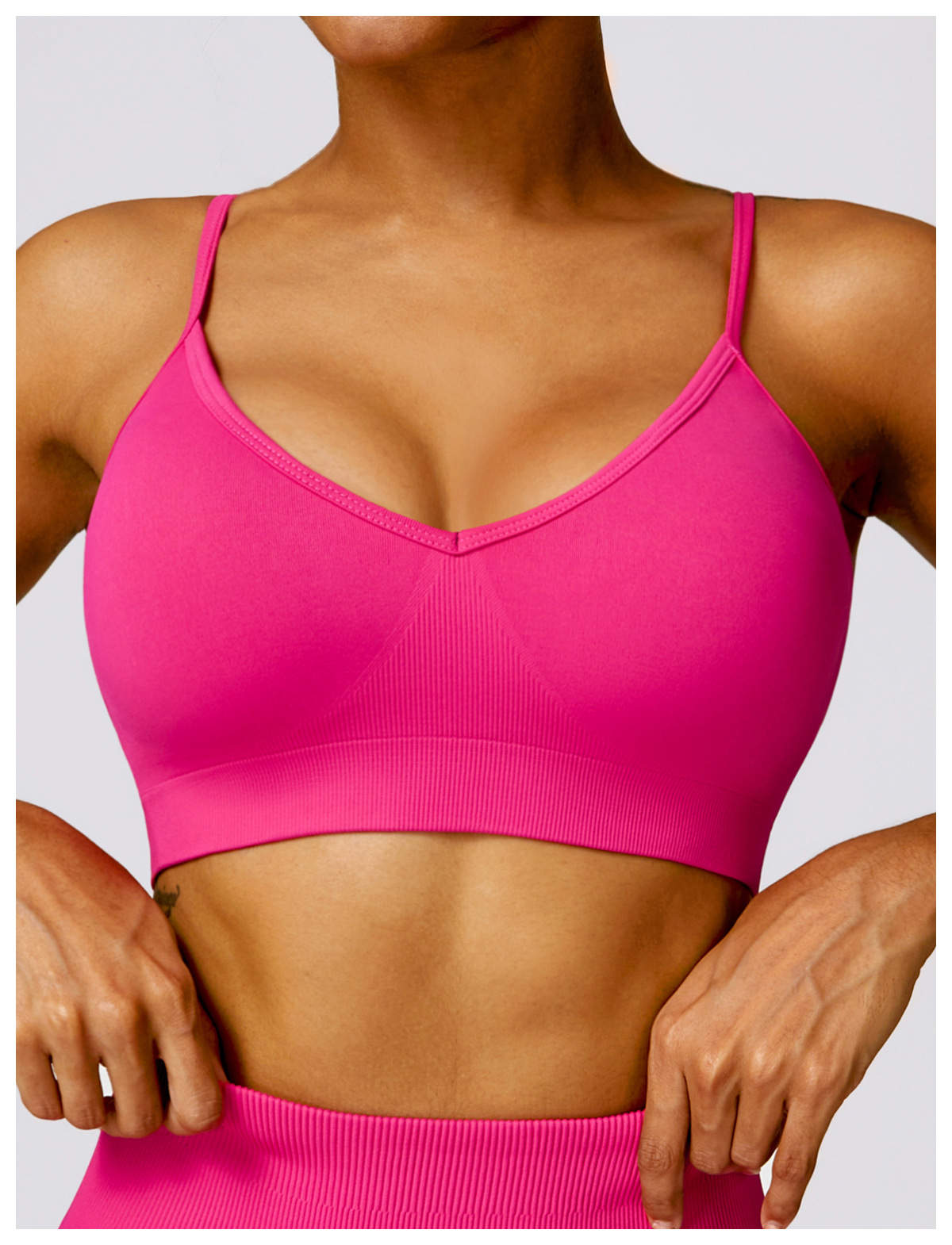 Close-up of a model wearing a blue sports bra from Sansara Sportswear, showcasing style and comfort for activewear.