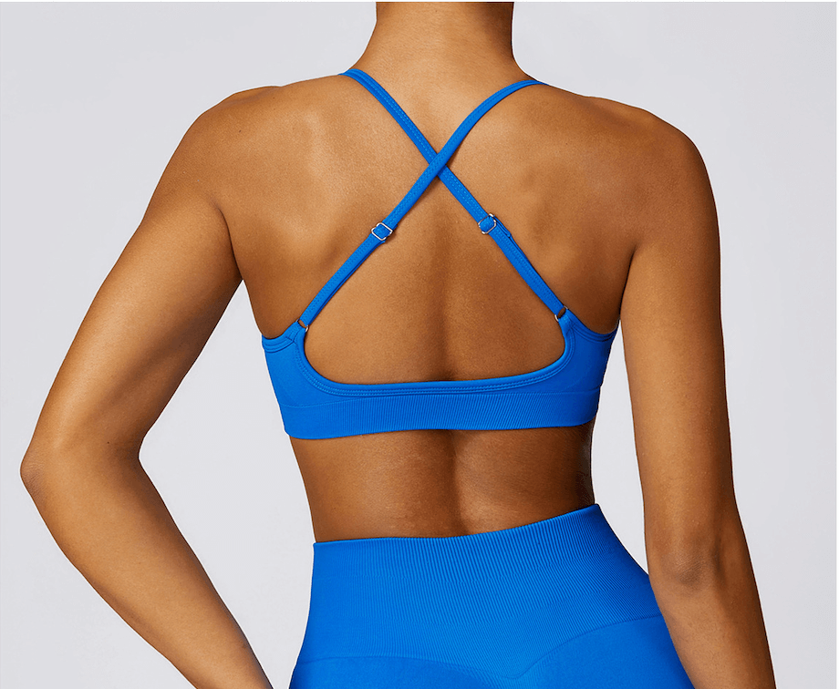 Close-up of a model wearing a blue sports bra from Sansara Sportswear, showcasing style and comfort for activewear.